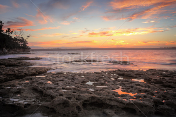 Sonnenuntergang Strand Wasser Wolken Natur Ozean Stock foto © lovleah