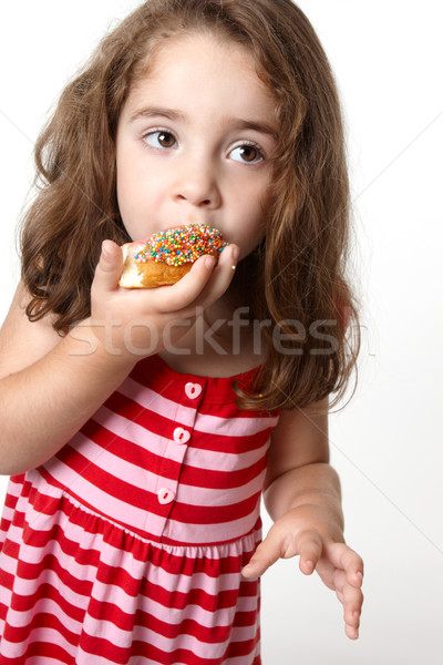 Pretty little girl eating a doughnut Stock photo © lovleah