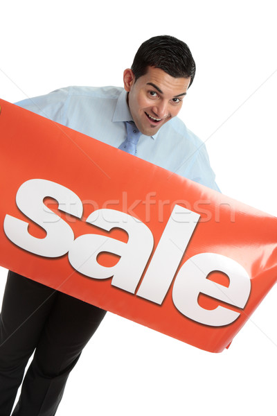 Happy businesman or saleman with sale sign Stock photo © lovleah