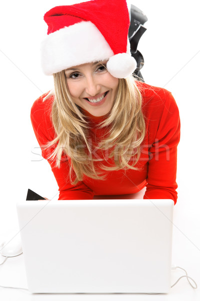 Smiling happy Christmas girl at laptop Stock photo © lovleah