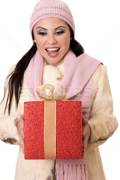 Delightful Surprise - Female holding a large red and gold gift Stock photo © lovleah
