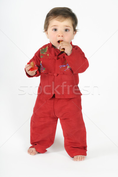 Standing baby eating TEETHING rusk Stock photo © lovleah