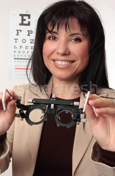 Optometrist holding trial frames Stock photo © lovleah