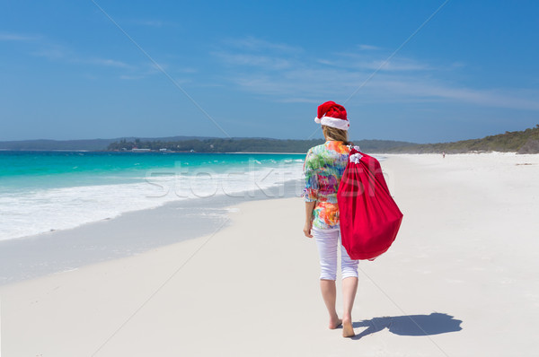 Christmas in Australia - woman walking along beach with festive  Stock photo © lovleah