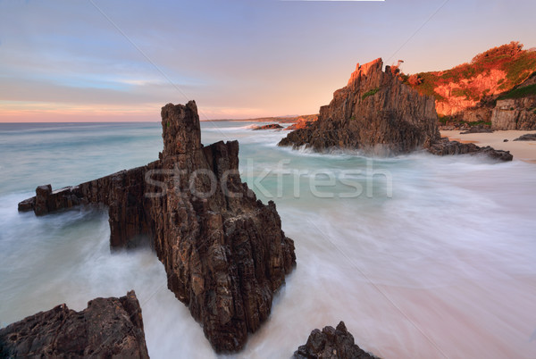 Ocean flows around volcanic sea stacks Stock photo © lovleah