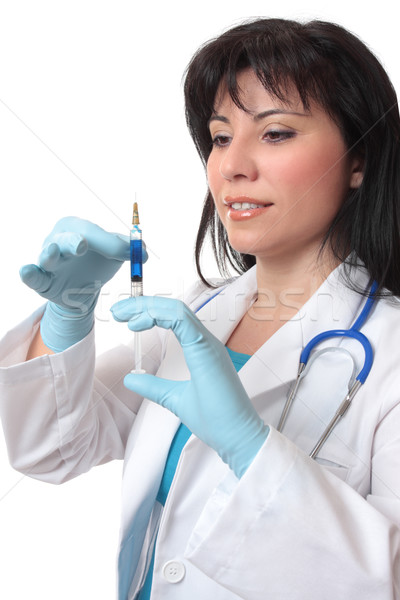 Female doctor preparing syringe Stock photo © lovleah