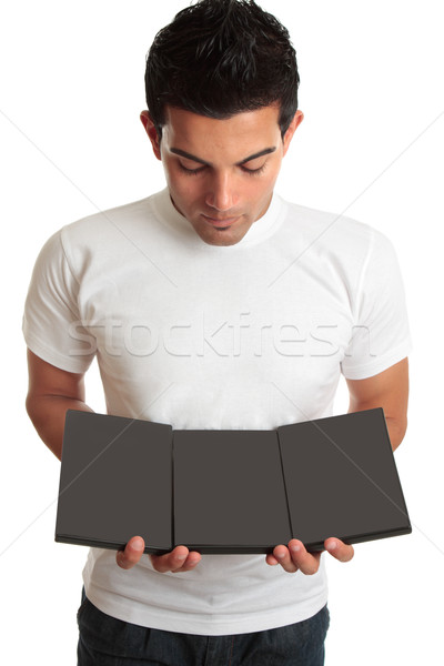 Man showing a set collection of DVD's Stock photo © lovleah