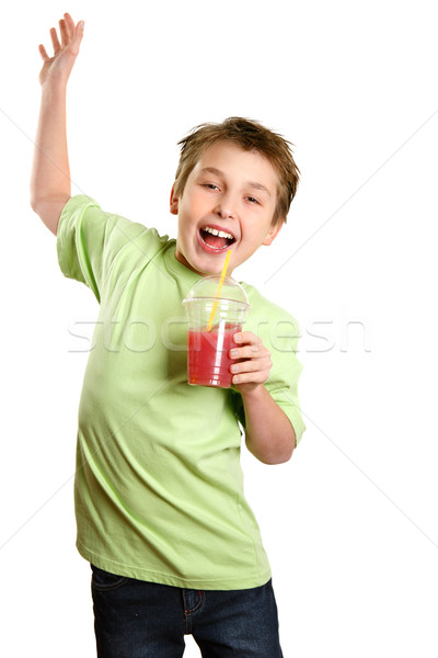 Jumping child holding healthy fruit juice Stock photo © lovleah