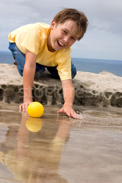 Stock photo: Child playing in water