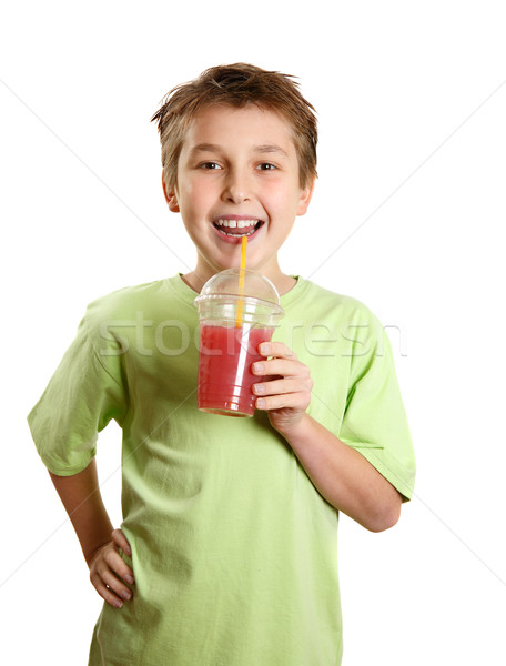 Smiling boy holding a fresh berry fruit juice Stock photo © lovleah