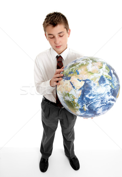 Boy holding blow up ball of the Earth world Stock photo © lovleah