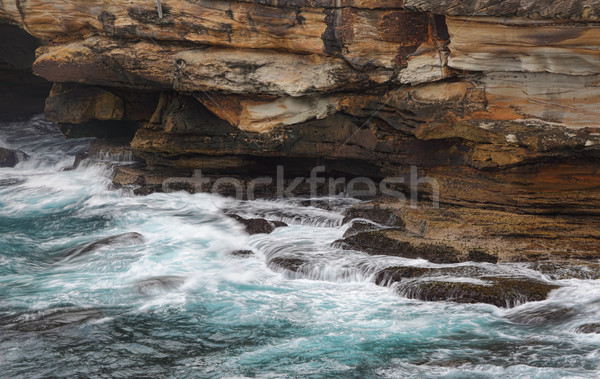 Ocean flows into sea caves Stock photo © lovleah