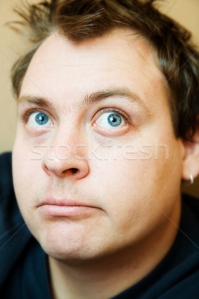 Boude jeune homme grand yeux bleus visage portrait Photo stock © lubavnel
