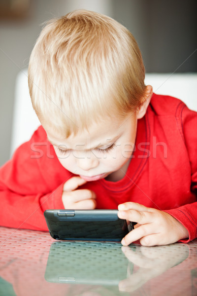 little boy with media player Stock photo © lubavnel