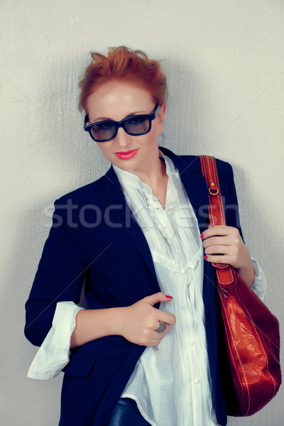 woman in black jacket with leather bag. Stock photo © lubavnel