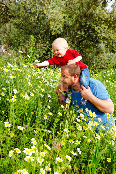 father and son in flowers Stock photo © lubavnel