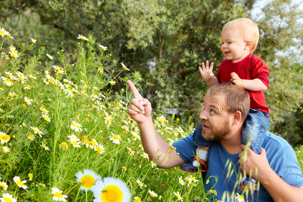 father and son in flowers Stock photo © lubavnel