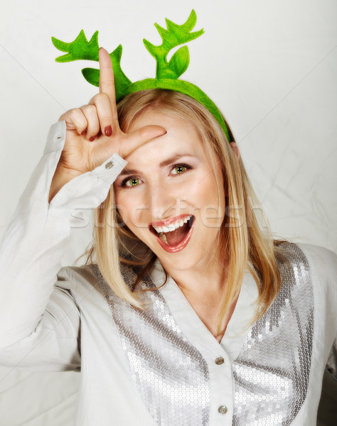reindeer hat on fun woman. Stock photo © lubavnel
