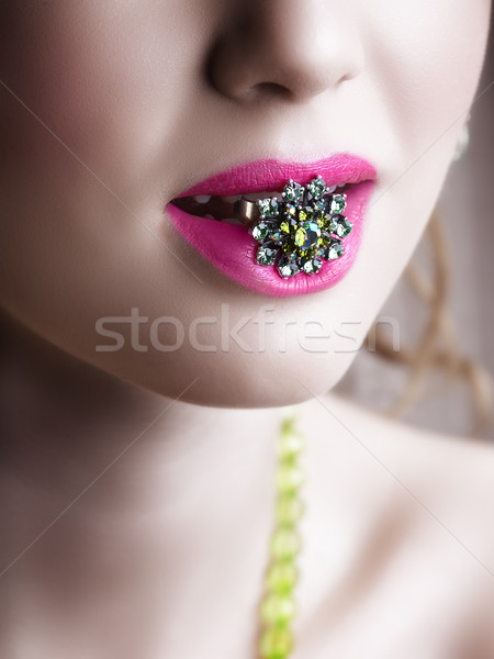 Green ring in pink lips. Stock photo © lubavnel