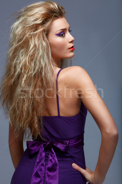 Stock photo: beautiful blond woman in purple dress.