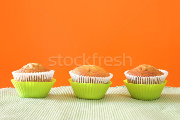 Three muffins in green cups Stock photo © lubavnel