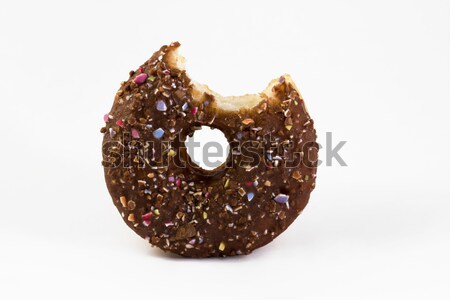 Doughnut with bite taken out over white Stock photo © lucielang