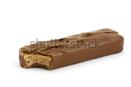 Chocolate bar with a missing bite over white Stock photo © lucielang