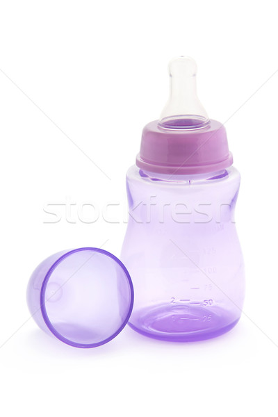 Puple babies bottle on white Stock photo © lucielang