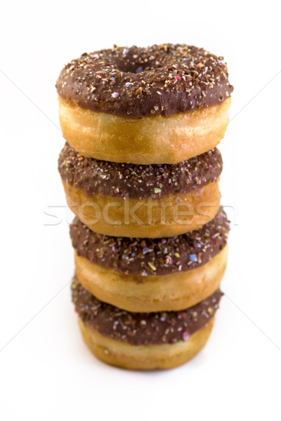 Stack of chocolate doughnuts over white Stock photo © lucielang