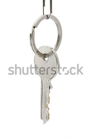 Stock photo: Single key hanging on a key ring over white