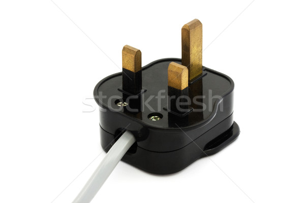 Black UK plug with a grey flex over white Stock photo © lucielang