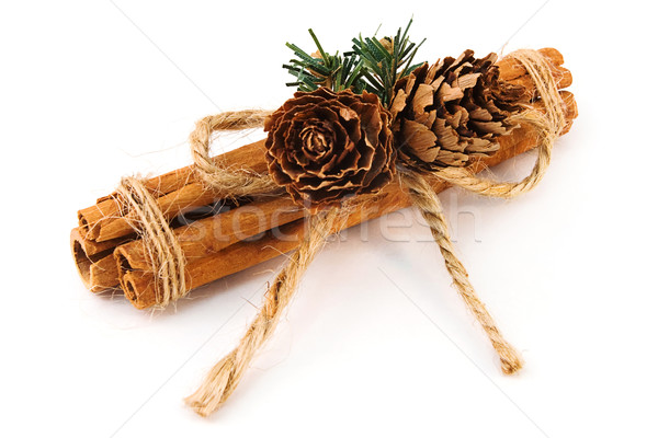 Festive Cinnamon stick decoation over white Stock photo © lucielang