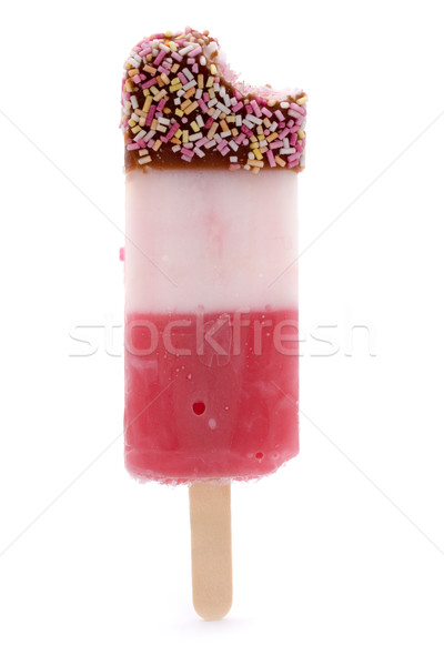 Ice lolly with sprinkles and amissing bite over white Stock photo © lucielang