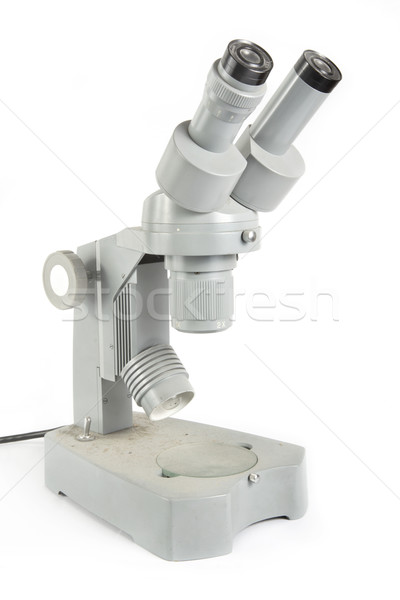 Old fashioned dirty microscope on white Stock photo © lucielang