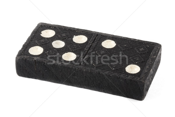Single old domino over white Stock photo © lucielang