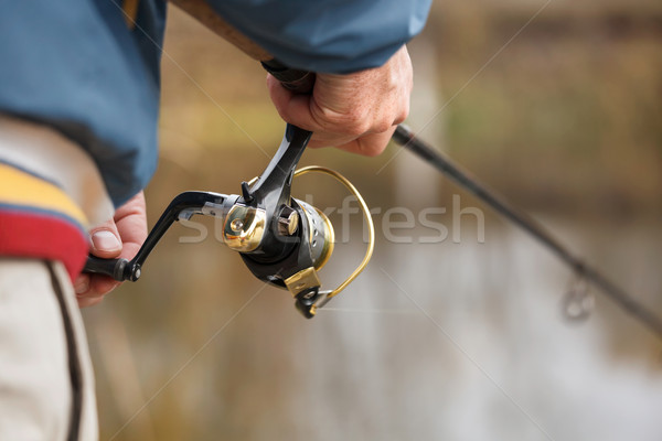 Fisherman`s hands with spinning. Stock photo © luckyraccoon