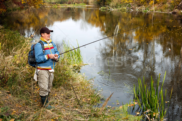 Fisherman with spinning. Stock photo © luckyraccoon