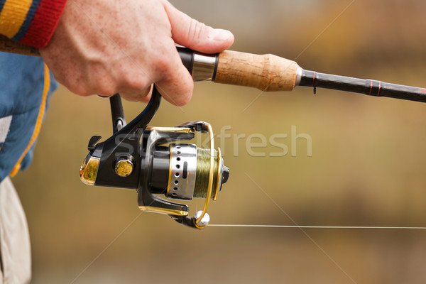 Fisherman`s hands with spinning. Stock photo © luckyraccoon