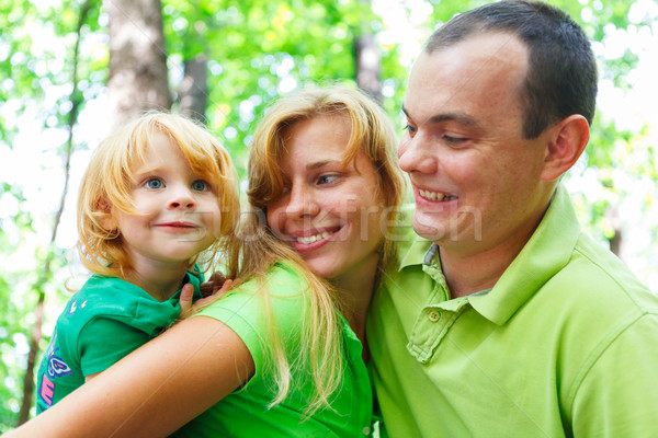 Portrait of a funny family having fun Stock photo © luckyraccoon