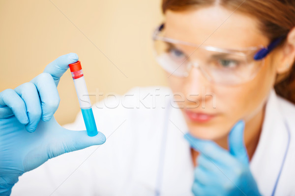 Young scientist working with samples in lab. Stock photo © luckyraccoon