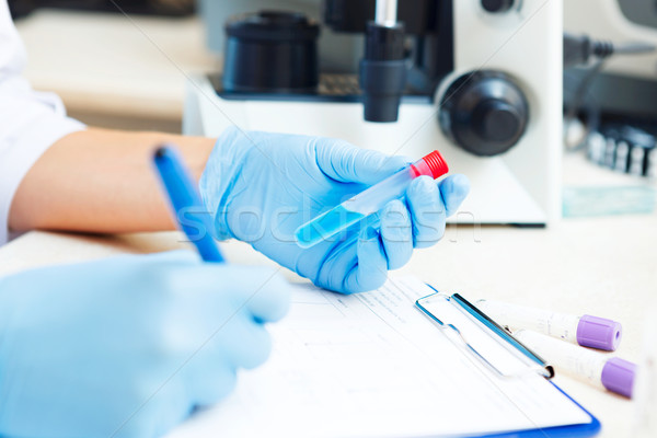 Scientist working with samples Stock photo © luckyraccoon