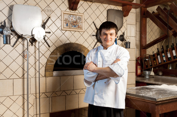 молодые повар Постоянный печи продовольствие счастливым Сток-фото © luckyraccoon