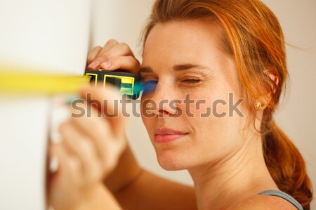 Portrait of young woman with measuring tape. Stock photo © luckyraccoon