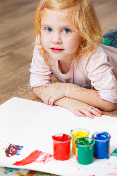 Cute little redhead girl painting. Stock photo © luckyraccoon