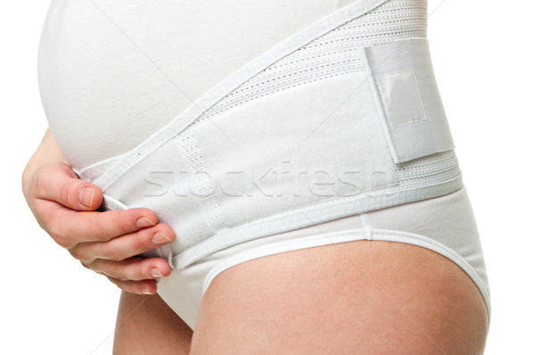 Primer plano jóvenes mujer embarazada corsé mujer feliz Foto stock © luckyraccoon