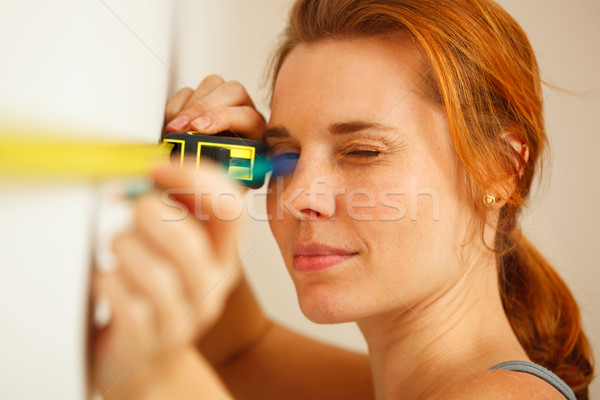 Portrait of young woman with measuring tape. Stock photo © luckyraccoon