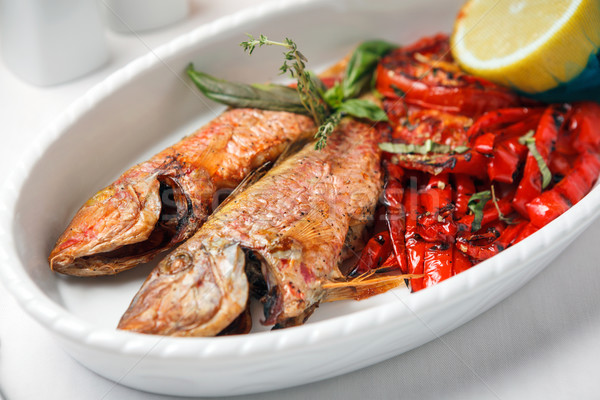 Fried fish with red peppers and lemon. Stock photo © luckyraccoon
