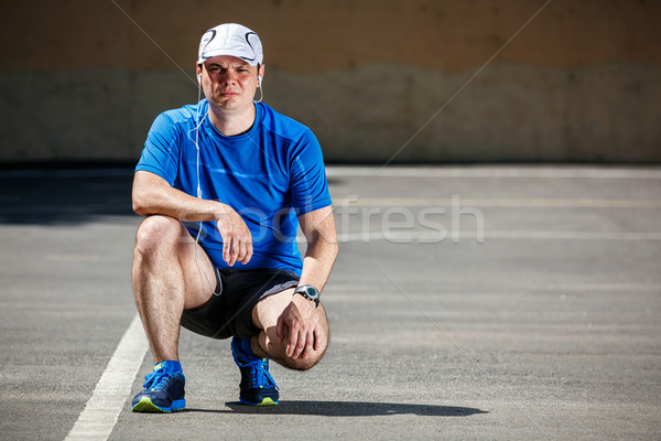 Young male runner getting ready to start. Stock photo © luckyraccoon