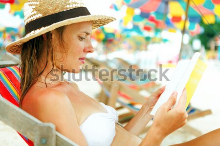 Portrait of a happy young woman posing while on the beach Stock photo © luckyraccoon