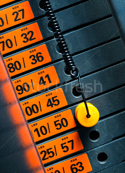 Closeup of weight stack with orange pin. Stock photo © luckyraccoon